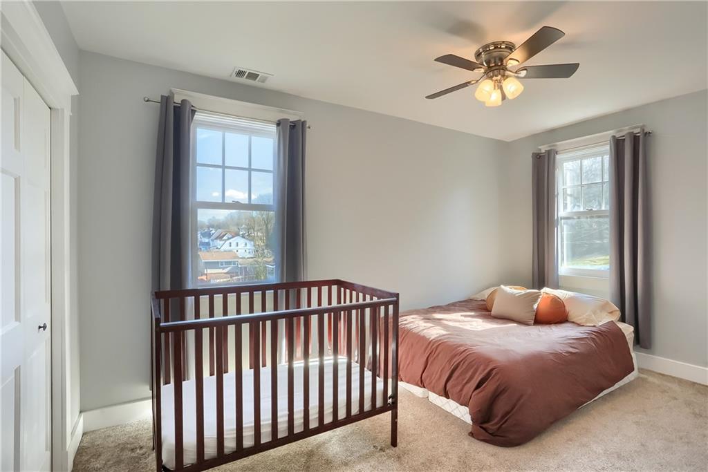 801 Main Street Coraopolis, PA 15108 - Photo 17 of 25 a bedroom with a bed and window