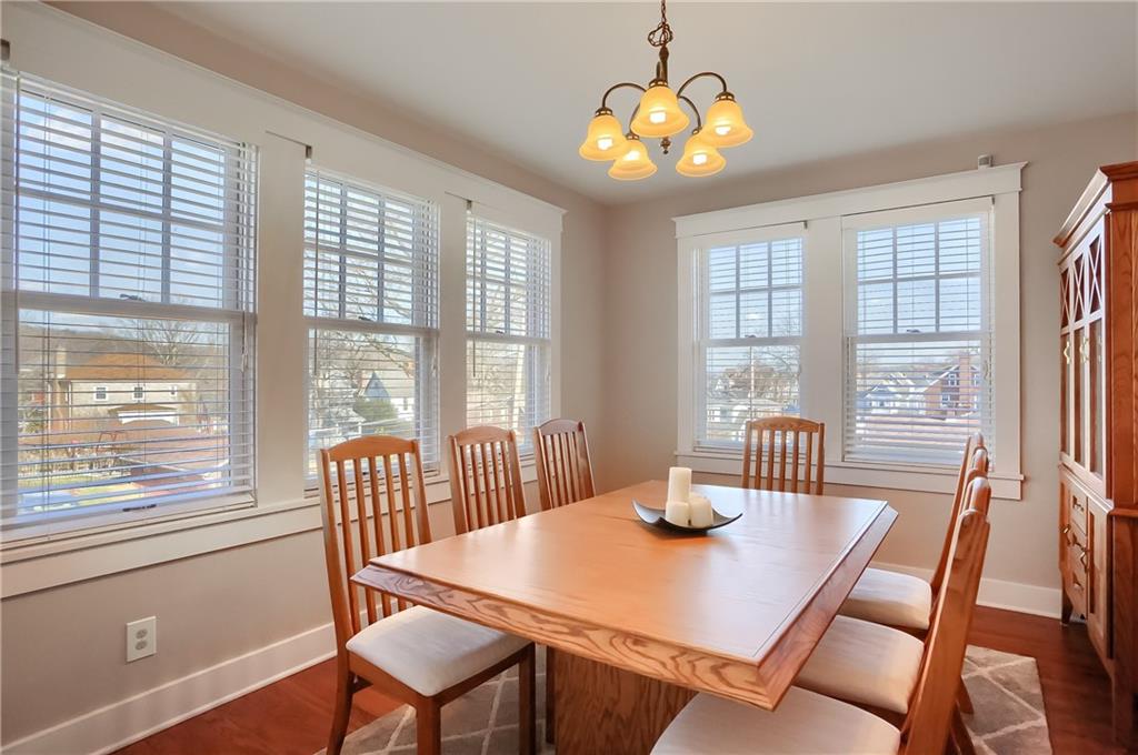 801 Main Street Coraopolis, PA 15108 - Photo 10 of 25 a view of a dining room with furniture a chandelier and wooden floor