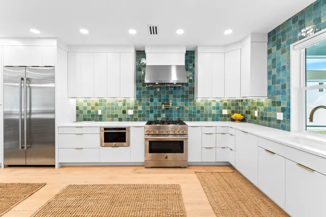 a kitchen with a stove and a microwave