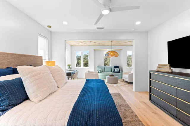 a bathroom with a sink double vanity granite tub shower and a mirror