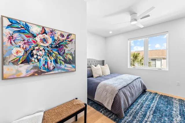 a bedroom with a bed and a dresser