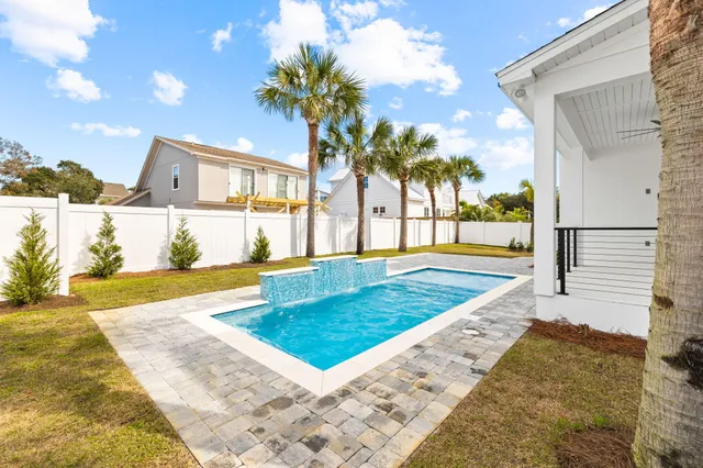 a view of a yard with swimming pool and outdoor space