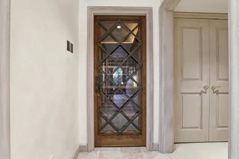 a view of a hallway with wooden floor and a hallway