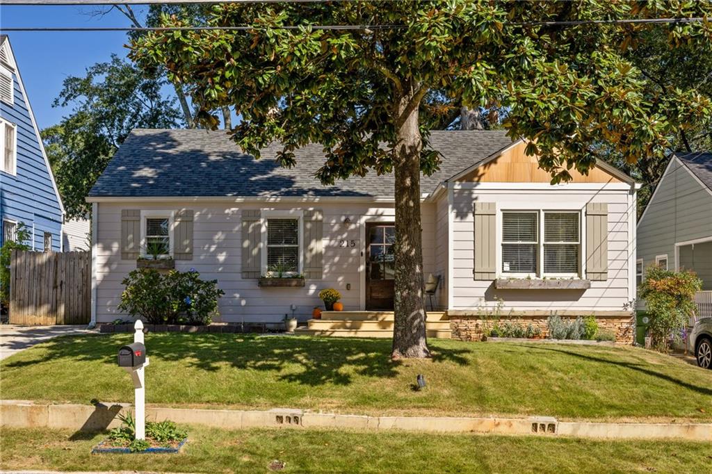 215 Sisson Avenue Northeast Atlanta, GA 30317 - Photo 1 of 1 a front view of a house with garden