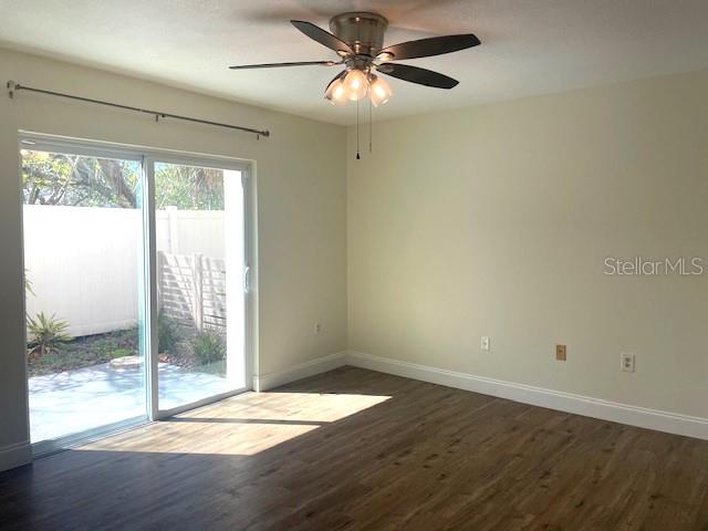 4800 Rilma Avenue, Unit 141 Sarasota, FL 34234 - Photo 11 of 19 a view of empty room with wooden floor and fan