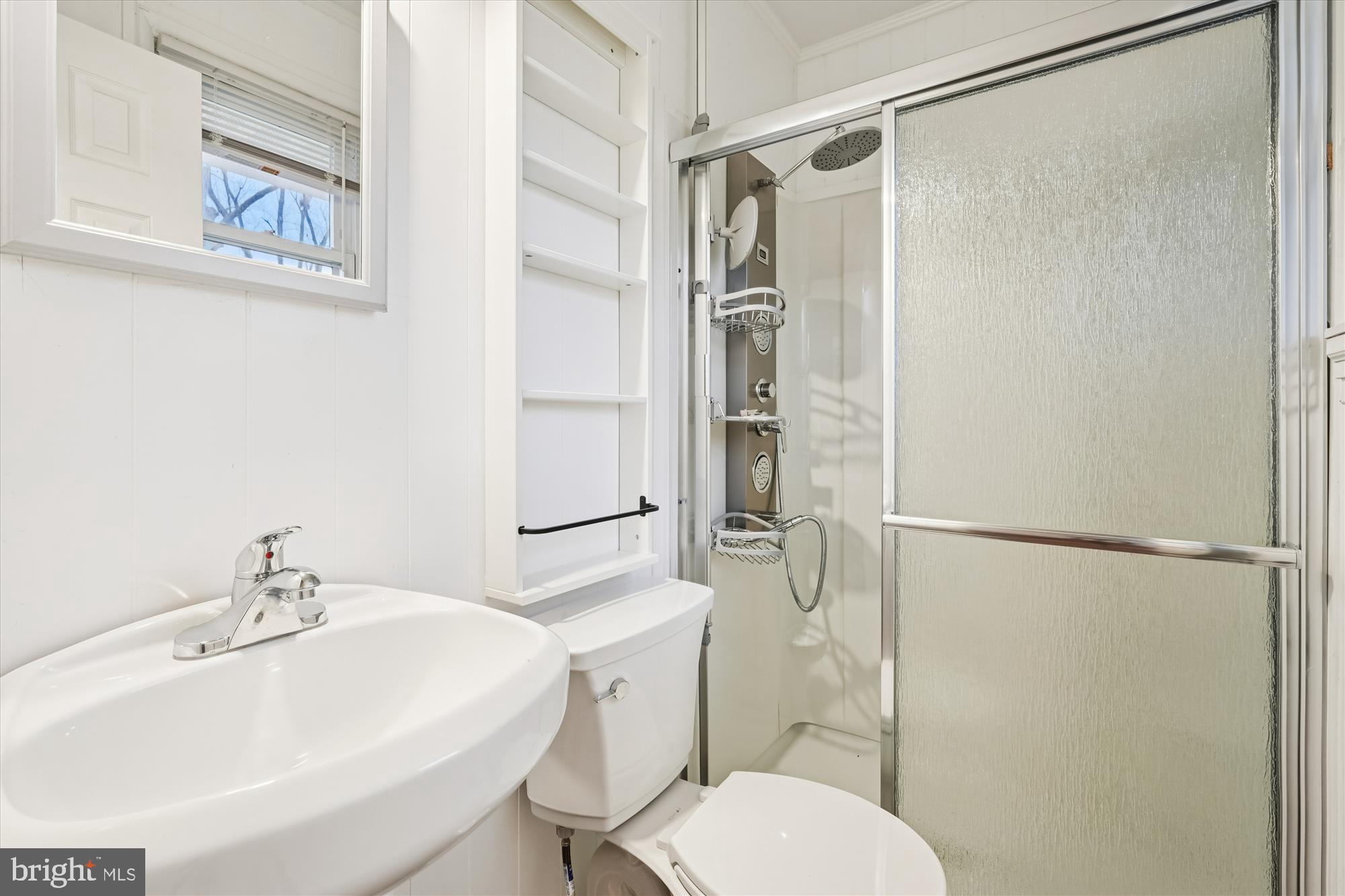10502 Glenhaven Drive Silver Spring, MD 20902 - Photo 12 of 38 a bathroom with a sink toilet and shower