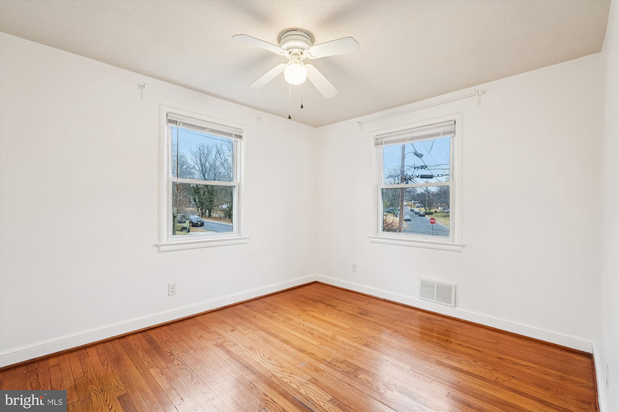 10502 Glenhaven Drive Silver Spring, MD 20902 - Photo 16 of 38 a view of empty room with wooden floor and fan