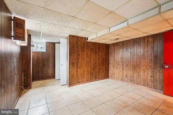 a view of a refrigerator in an empty room