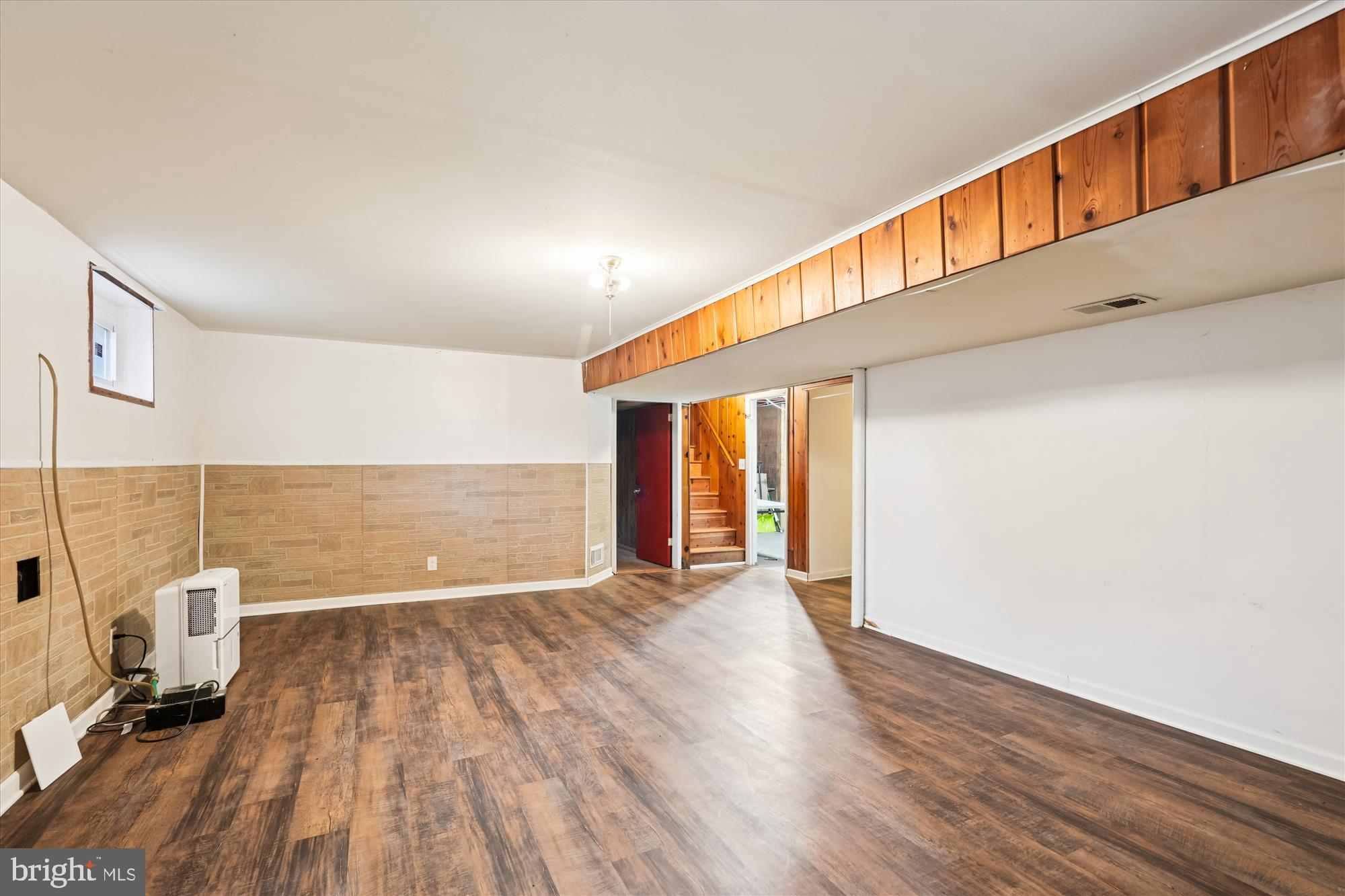 10502 Glenhaven Drive Silver Spring, MD 20902 - Photo 23 of 38 a view of a big room with wooden floor and windows
