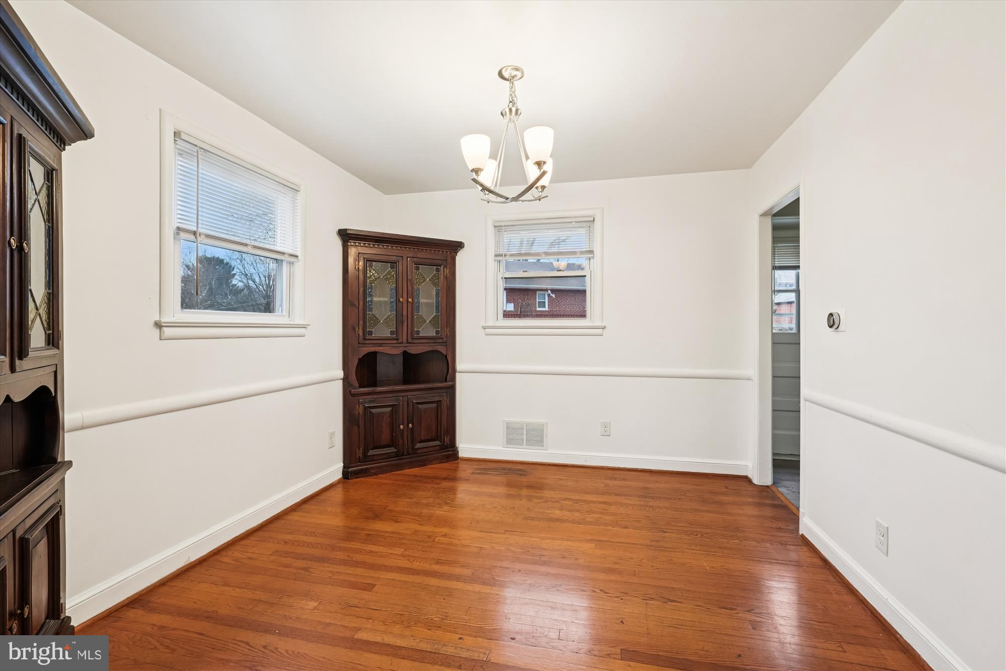10502 Glenhaven Drive Silver Spring, MD 20902 - Photo 9 of 38 a view of empty room with wooden floor and fan