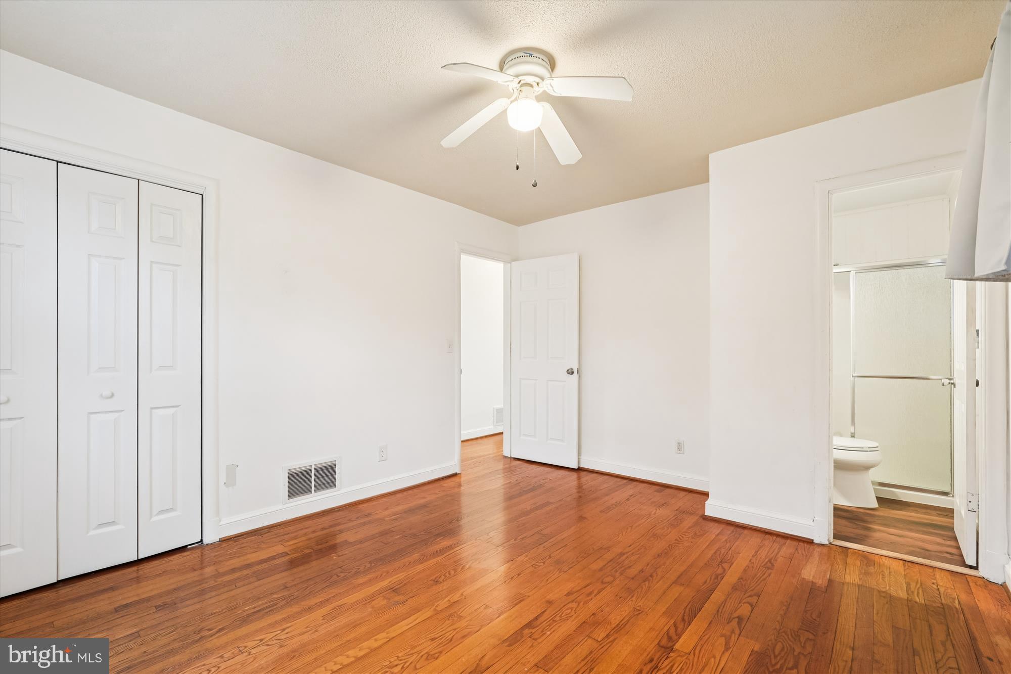 10502 Glenhaven Drive Silver Spring, MD 20902 - Photo 10 of 38 a view of a room with wooden floor and a ceiling fan