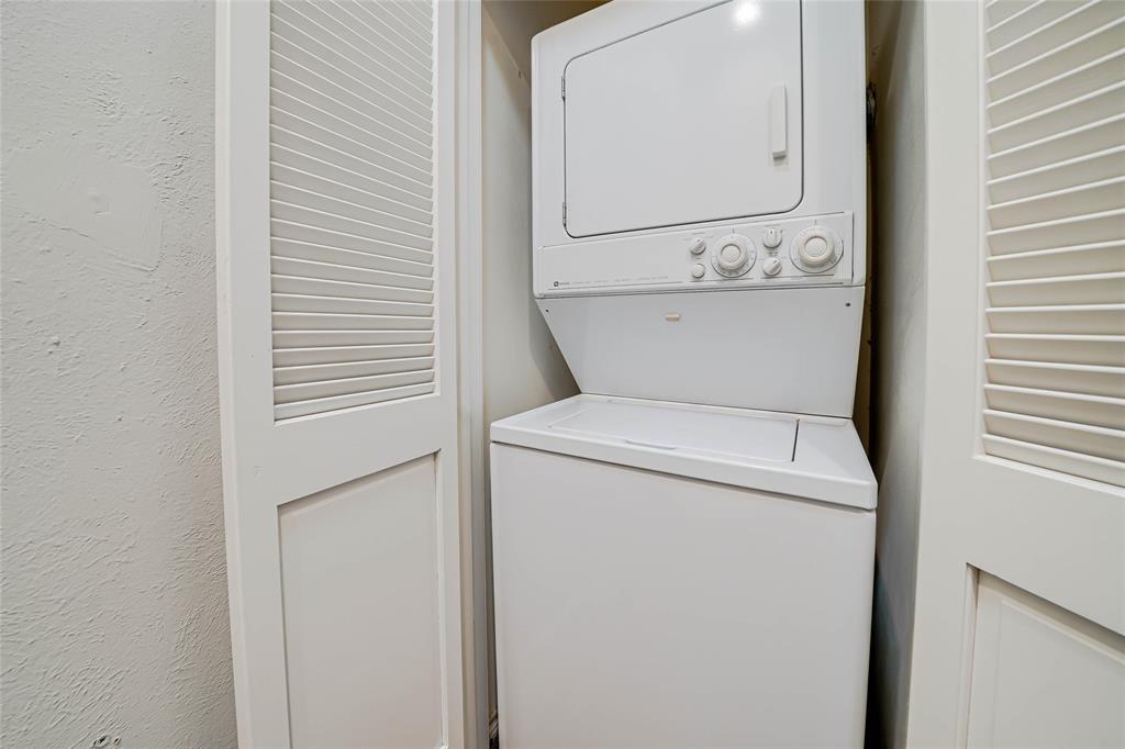 3605 Brown Street, Unit B108 Dallas, TX 75219 - Photo 14 of 18 a bathroom with a toilet sink and mirror