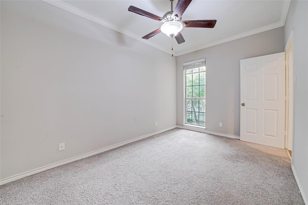 3605 Brown Street, Unit B108 Dallas, TX 75219 - Photo 8 of 18 an empty room with windows and fan