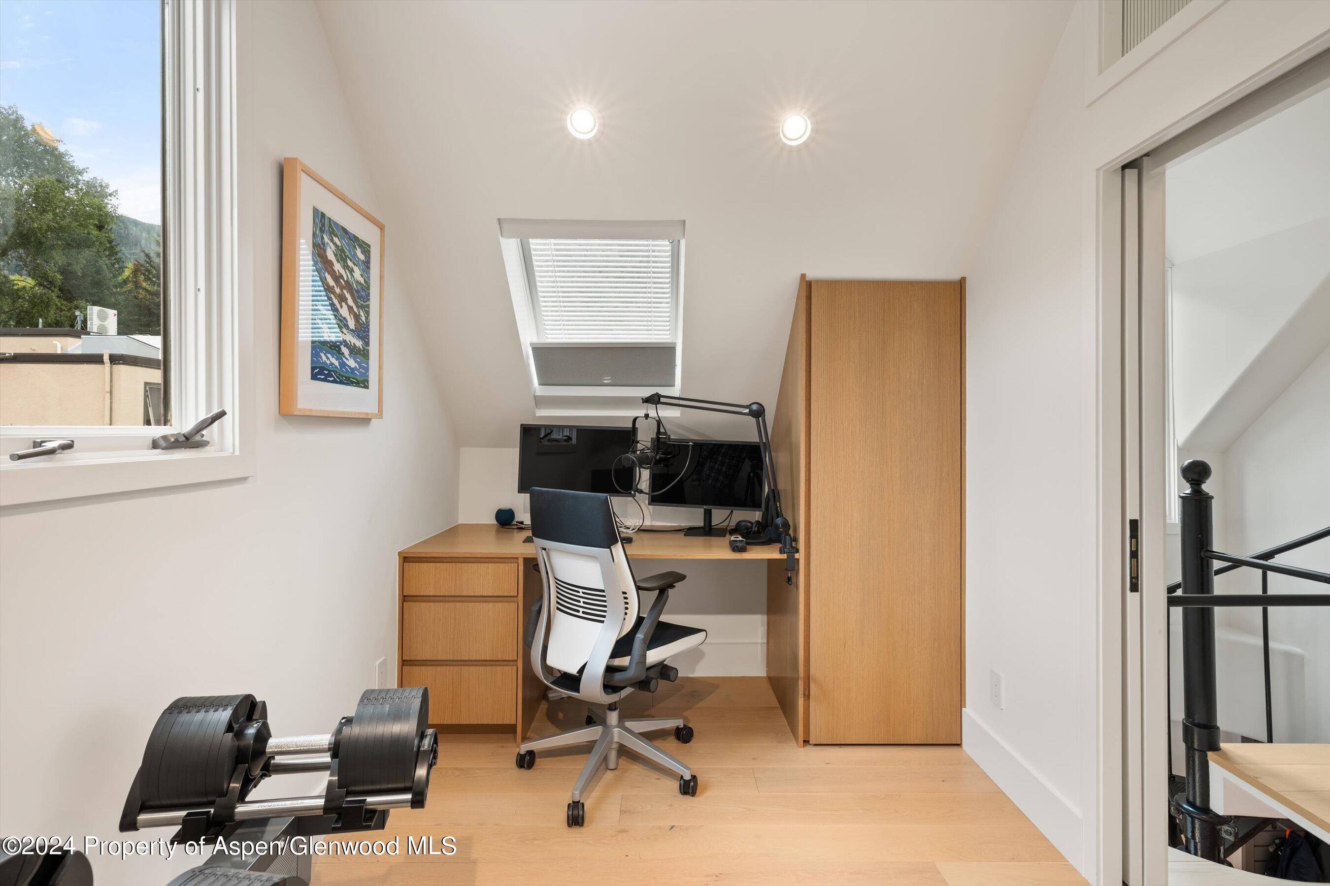 331 West Main Street, Unit B Aspen, CO 81611 - Photo 15 of 21 a view of a workspace with furniture and a window