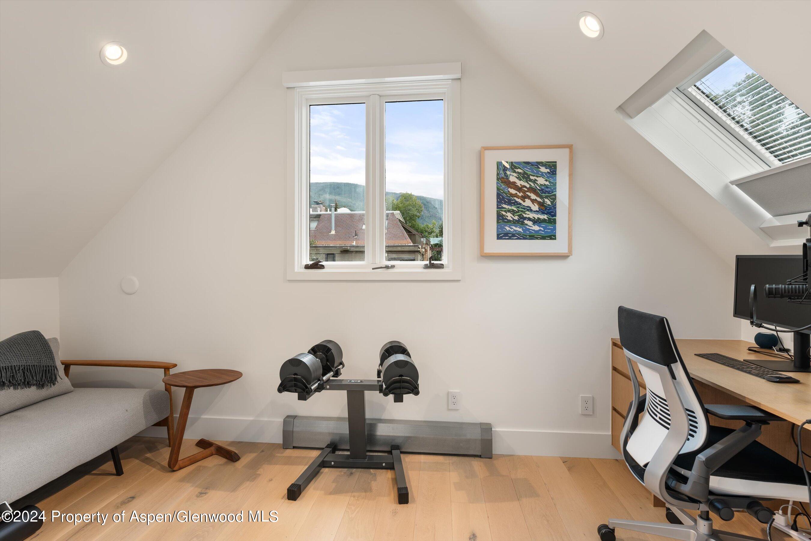 331 West Main Street, Unit B Aspen, CO 81611 - Photo 17 of 21 a view of a workspace with furniture and a window