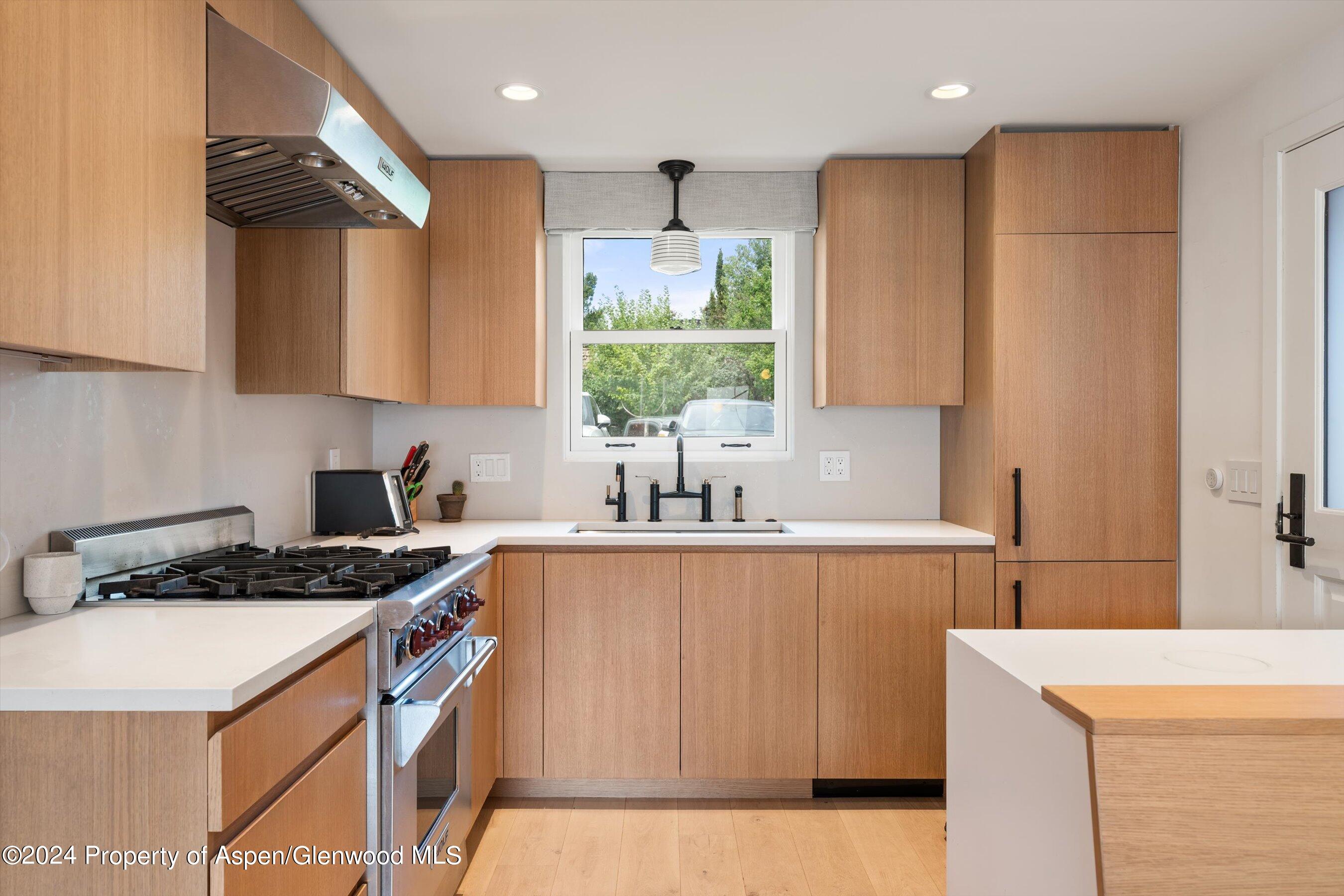331 West Main Street, Unit B Aspen, CO 81611 - Photo 7 of 21 a kitchen with a sink a stove a refrigerator and a stove