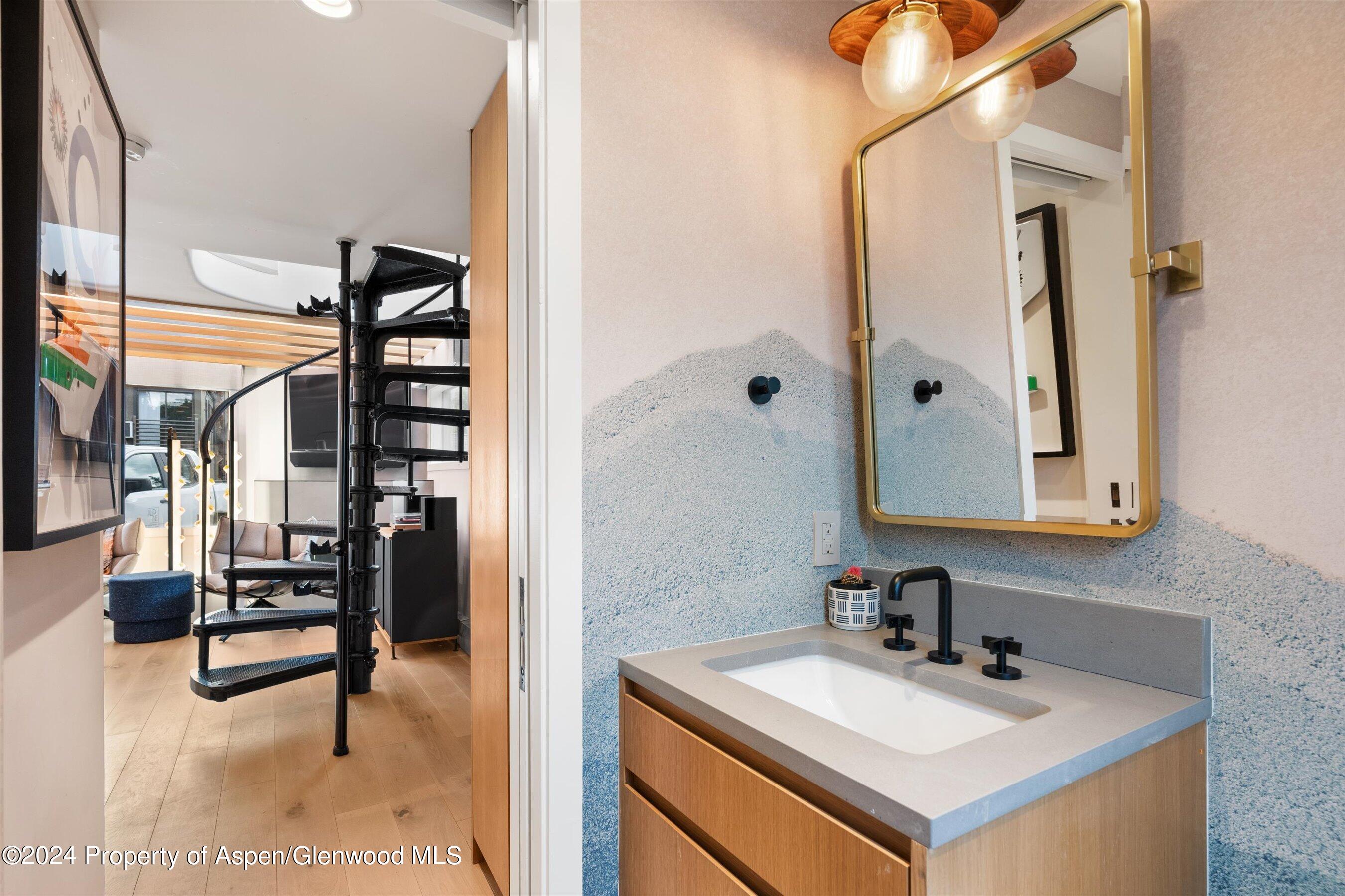 331 West Main Street, Unit B Aspen, CO 81611 - Photo 9 of 21 a bathroom with a sink and a mirror