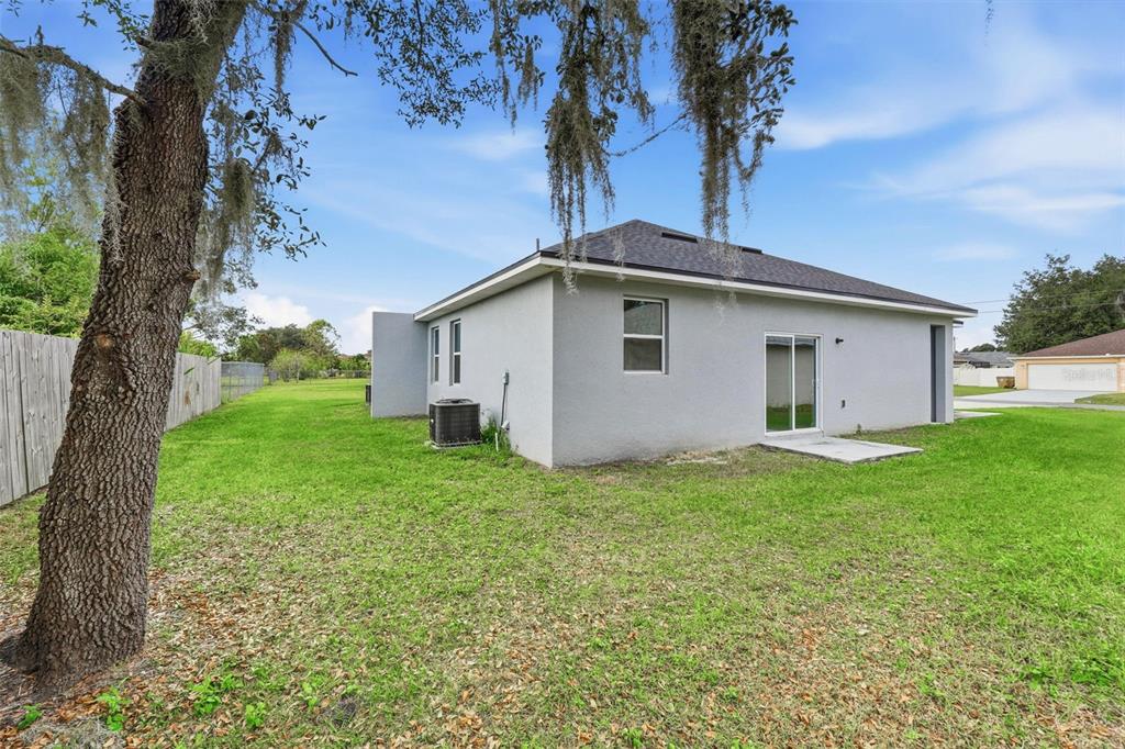 314 Colonade Court, Unit B Kissimmee, FL 34758 - Photo 22 of 24 a view of a house with backyard and garden