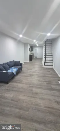 a view of hallway with wooden floor
