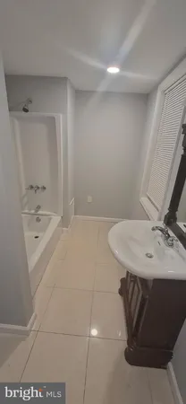 a bathroom with a sink and mirror