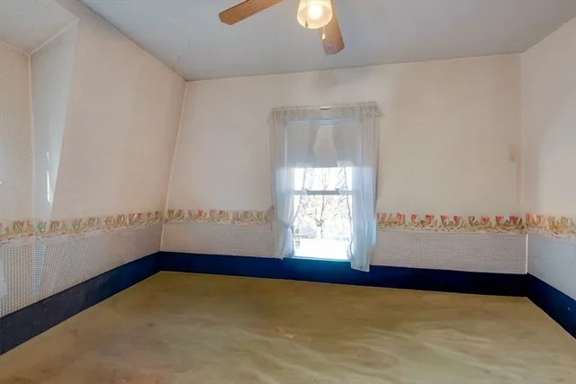 a view of an empty room and window