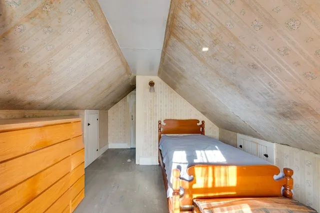 a living room with a couch and chandelier
