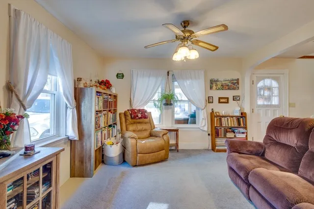 a living room with furniture and a window
