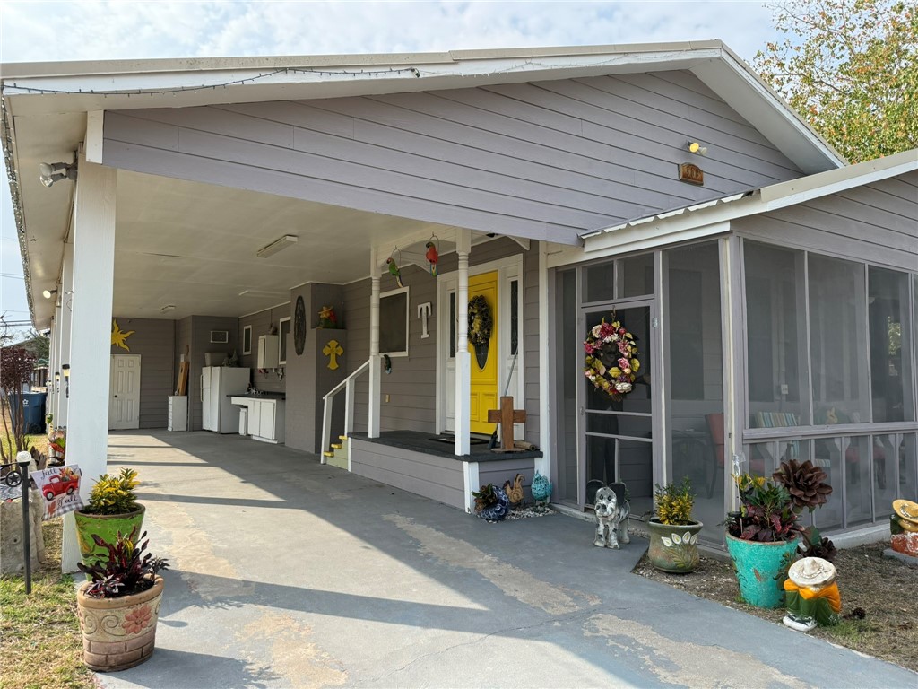 a front view of a house with outdoor seating