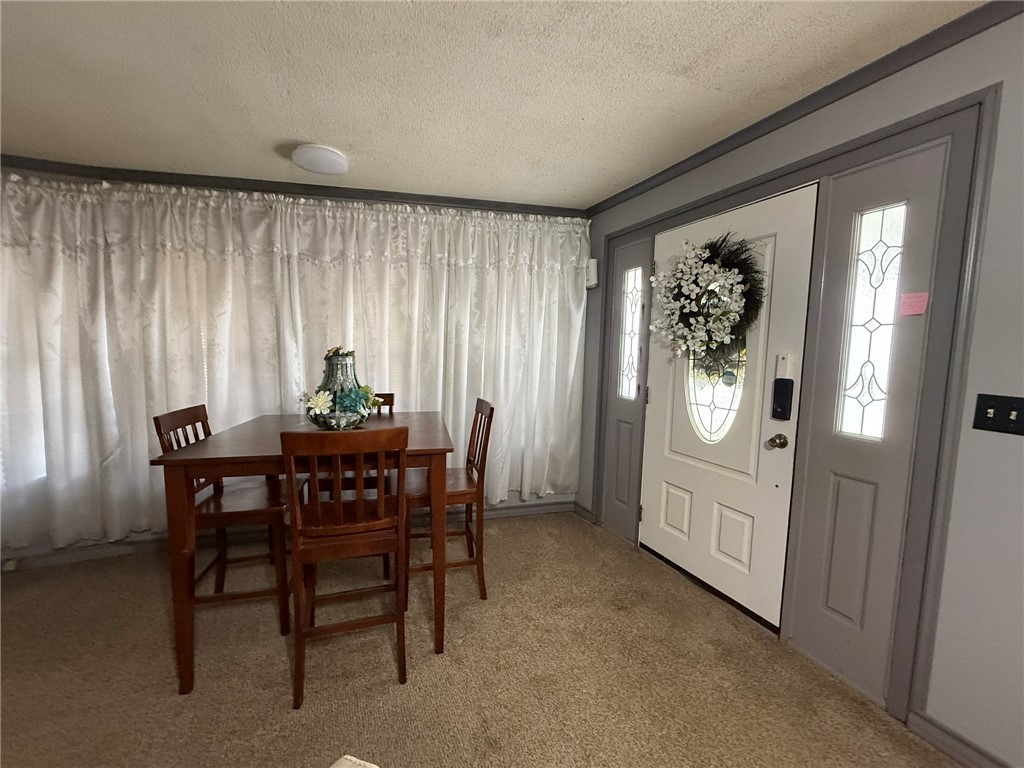 508 East Thornton Street Three Rivers, TX 78071 - Photo 2 of 17 a view of a dining room with furniture and window