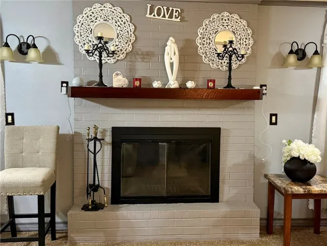 a kitchen with white cabinets and appliances