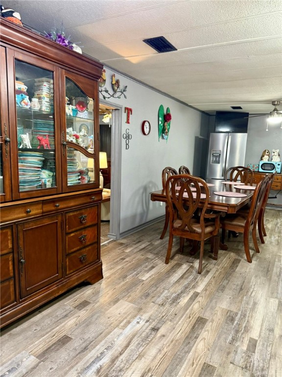 508 East Thornton Street Three Rivers, TX 78071 - Photo 8 of 17 a view of a dining room with furniture window and wooden floor