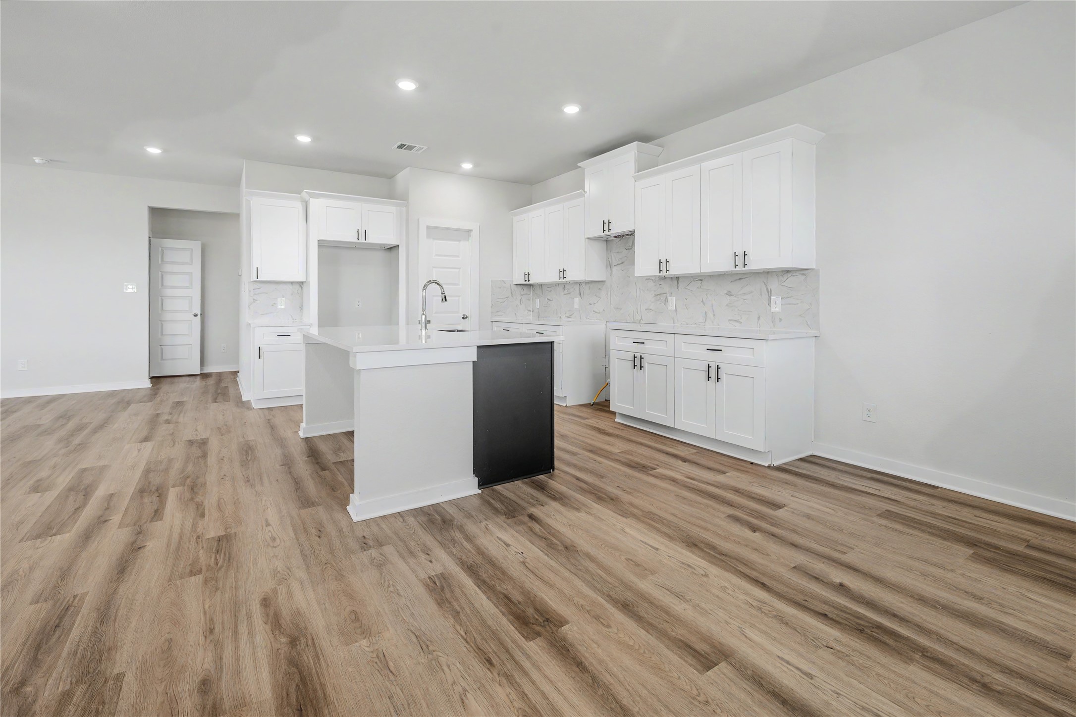 6427 Bolinas Court Rosharon, TX 77583 - Photo 13 of 49 a kitchen with a white wooden cabinets stainless steel appliances and a sink