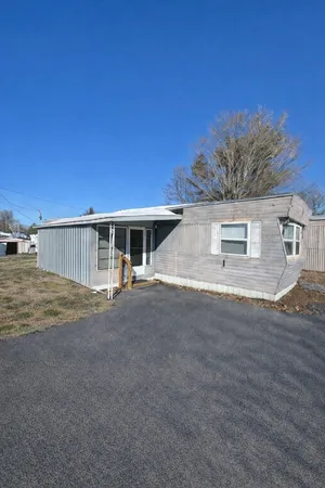 a view of a house with a street