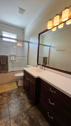 a bathroom with a double vanity sink and a mirror