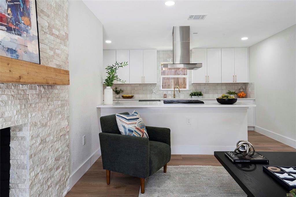 10416 Church Road Dallas, TX 75238 - Photo 13 of 36 a kitchen with stainless steel appliances granite countertop a sink a stove and a wooden floors