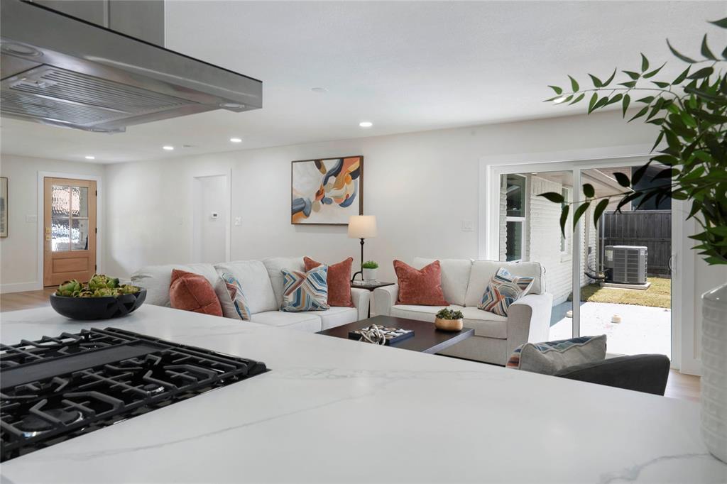 10416 Church Road Dallas, TX 75238 - Photo 19 of 36 a bedroom with furniture or couch and a potted plant