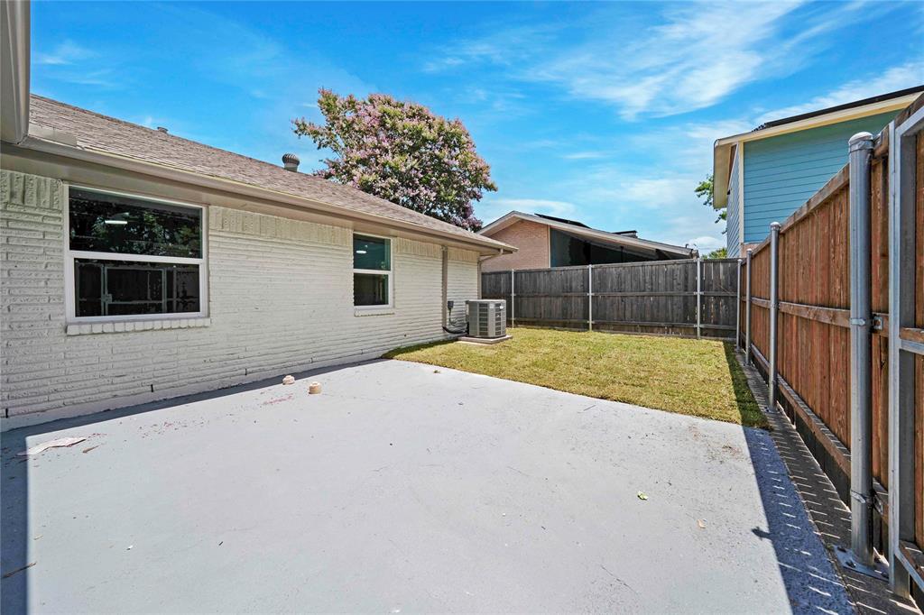 10416 Church Road Dallas, TX 75238 - Photo 32 of 36 a view of backyard with a garden and entryway