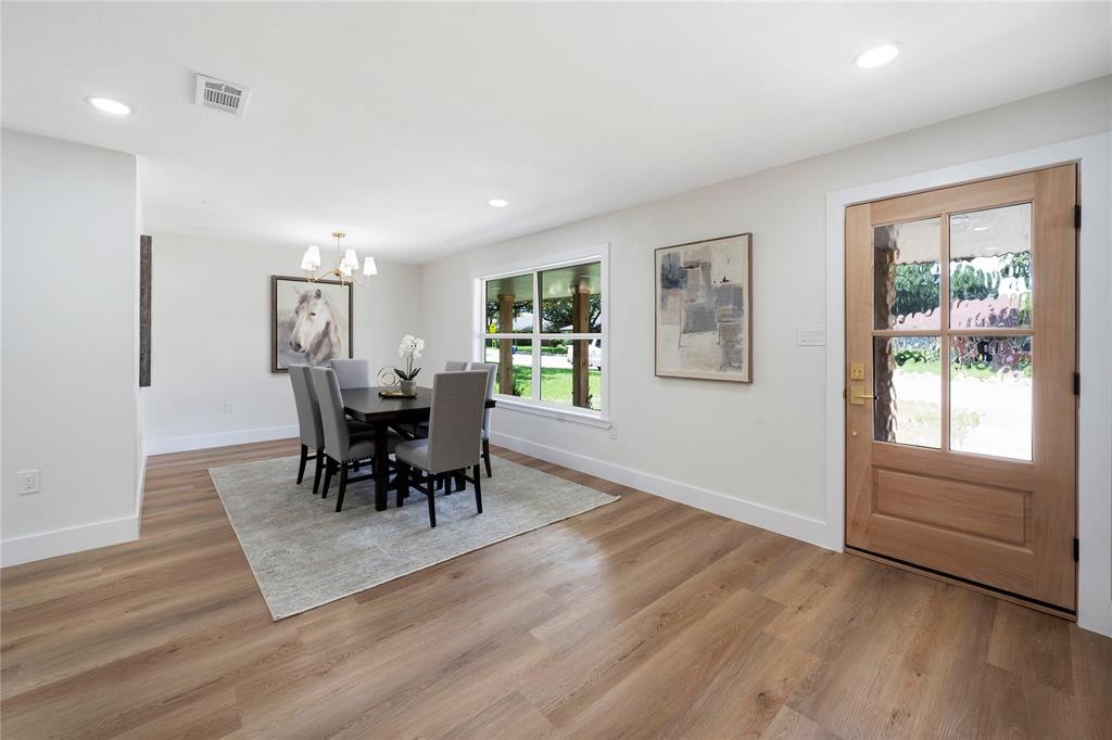 10416 Church Road Dallas, TX 75238 - Photo 5 of 36 a view of a livingroom with furniture window and wooden floor