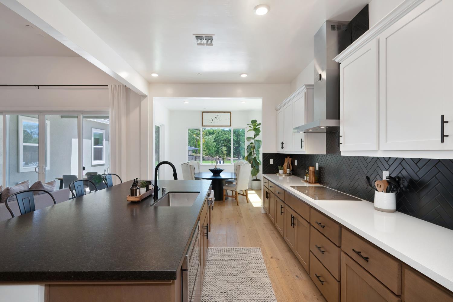 5085 Pryor Drive Rescue, CA 95672 - Photo 17 of 50 a kitchen with sink a stove and cabinets