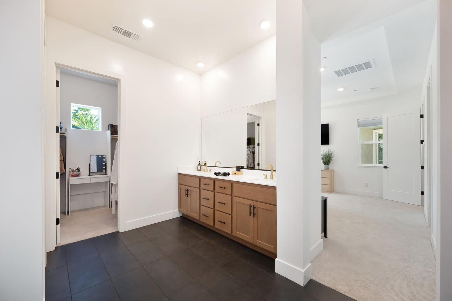5085 Pryor Drive Rescue, CA 95672 - Photo 33 of 50 a bathroom with a double vanity sink and a mirror