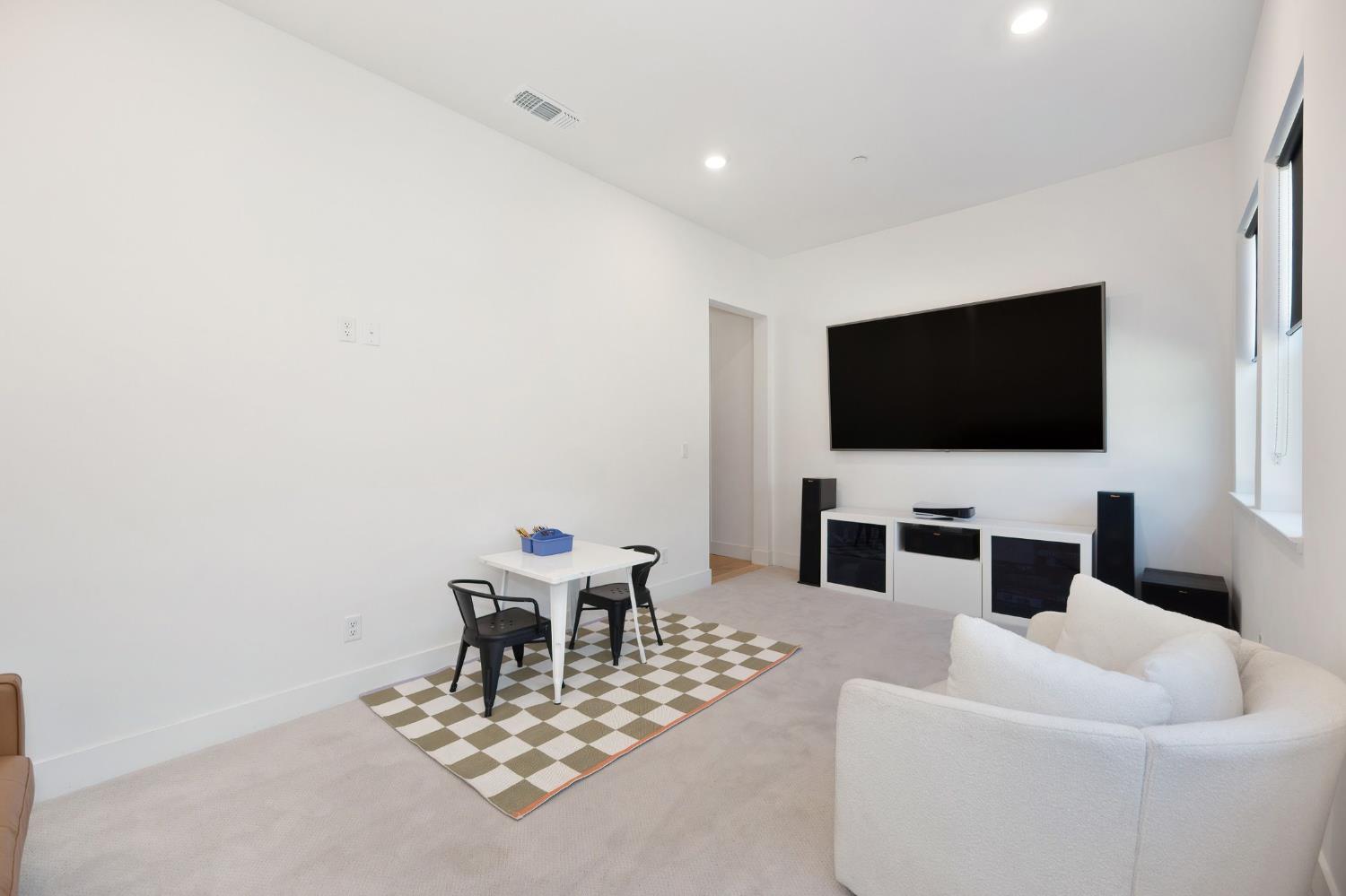 5085 Pryor Drive Rescue, CA 95672 - Photo 40 of 50 a living room with furniture and a flat screen tv