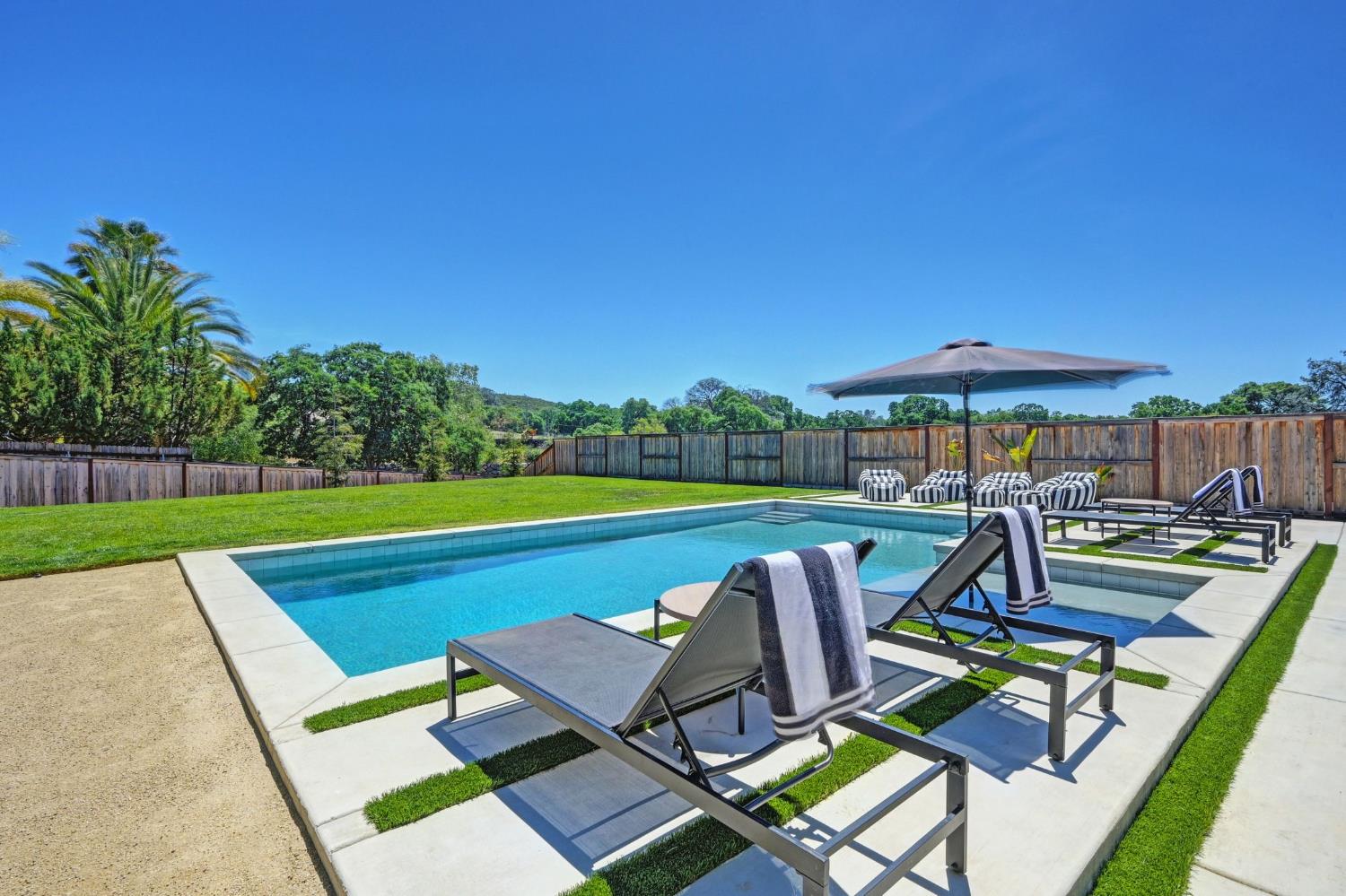 5085 Pryor Drive Rescue, CA 95672 - Photo 42 of 50 a view of a swimming pool with lounge chairs in patio