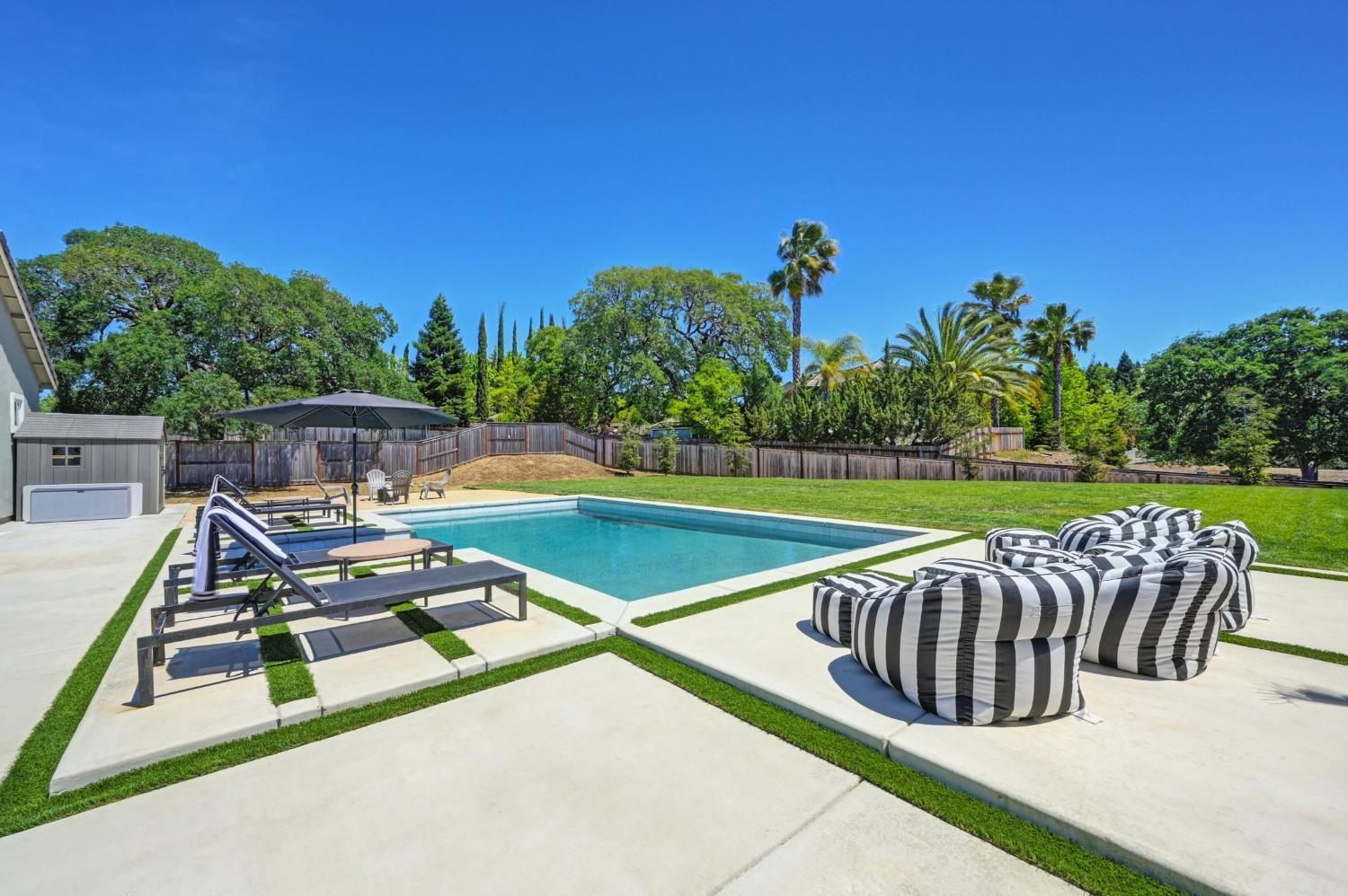 5085 Pryor Drive Rescue, CA 95672 - Photo 43 of 50 a view of a swimming pool with a patio