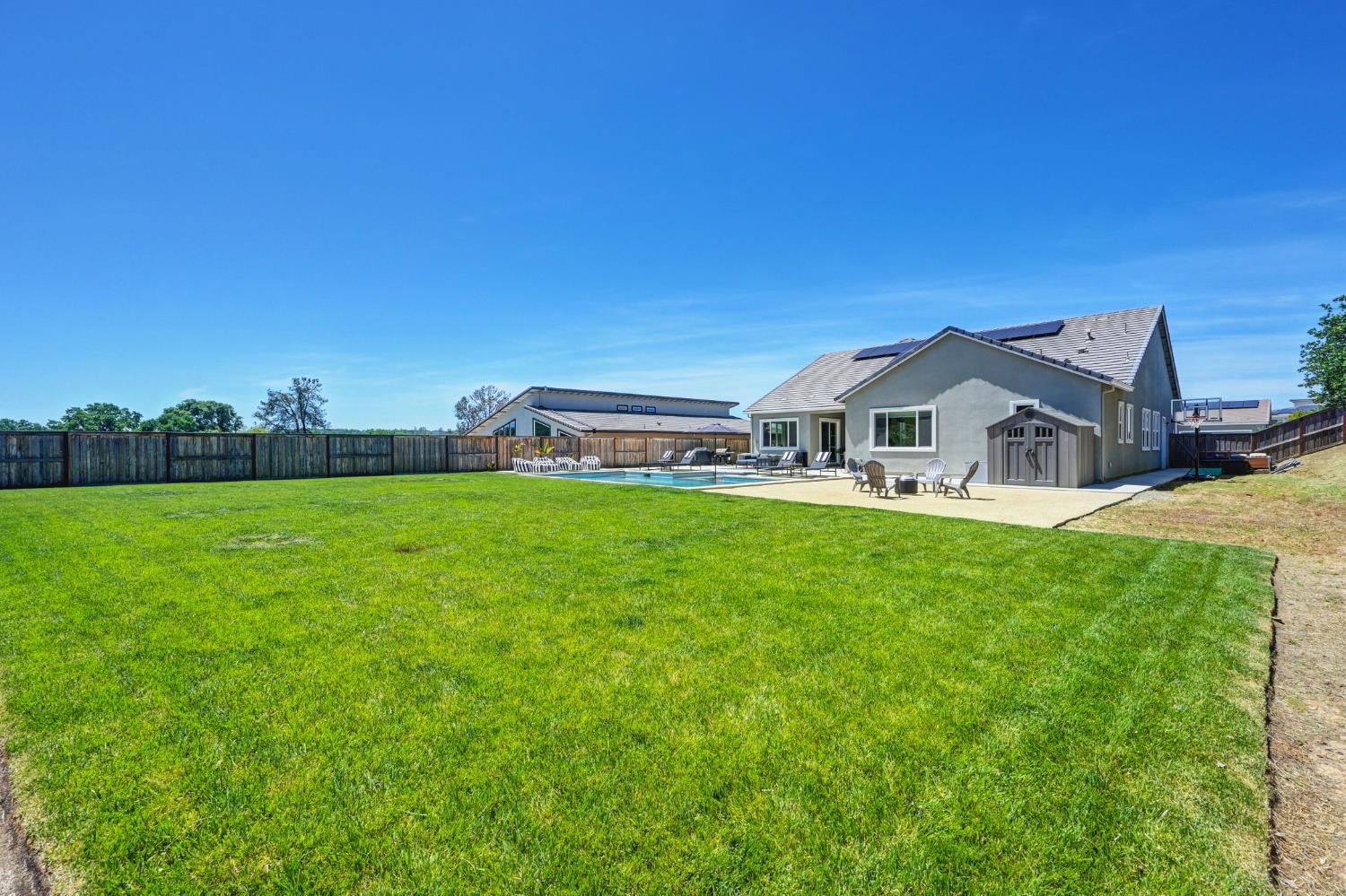 5085 Pryor Drive Rescue, CA 95672 - Photo 45 of 50 a white house with a big yard and big trees with a big yard