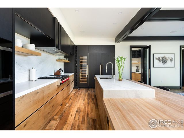 a kitchen with a sink and a refrigerator