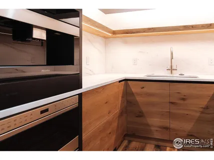 a bathroom with a sink mirror and vanity