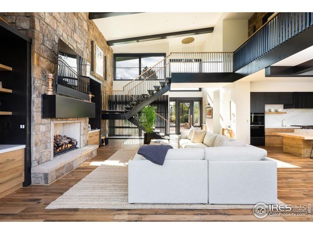 a view of a living room with wooden floor