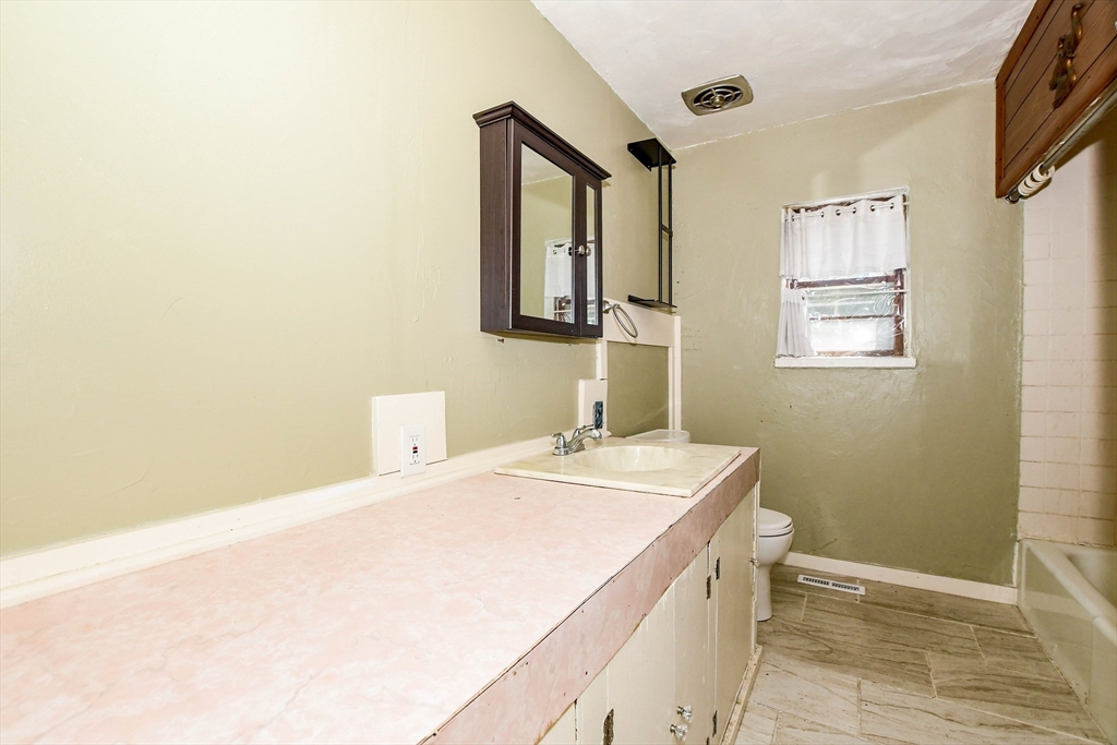6 Gilbert Way Wareham, MA 02571 - Photo 30 of 41 a bathroom with a sink a vanity and a mirror