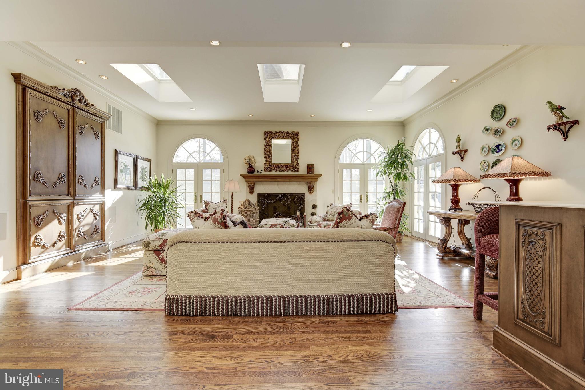 9812 Meriden Road Rockville, MD 20854 - Photo 10 of 30 Family room with built-in armoire