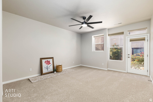2158 Balboa Way St. George, UT 84770 - Photo 21 of 40 Spare room with light carpet and ceiling fan